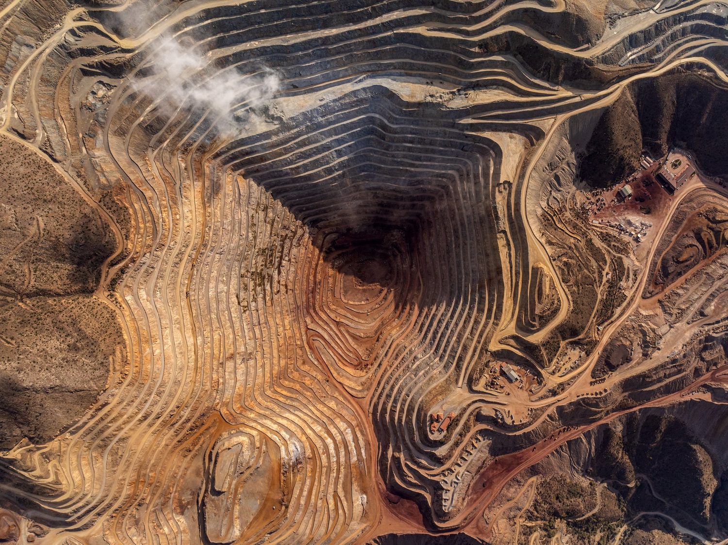 Aerial view of an open-pit mine — the setting of Chapter One.