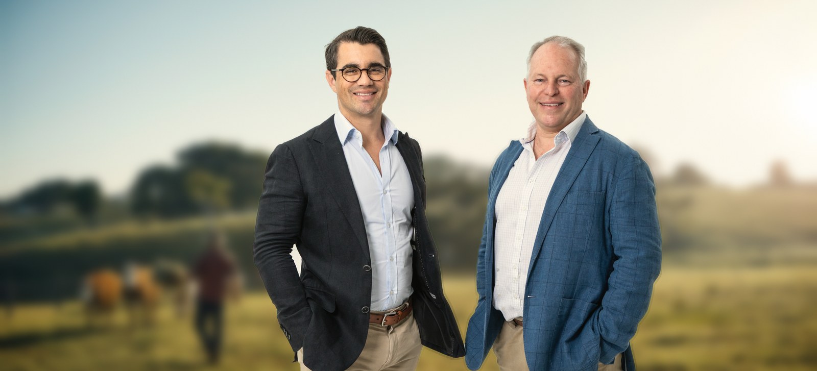 Nick van der Hoven and Craig Morris, the principals of Equipoise & Co, standing in Australian grazing country.